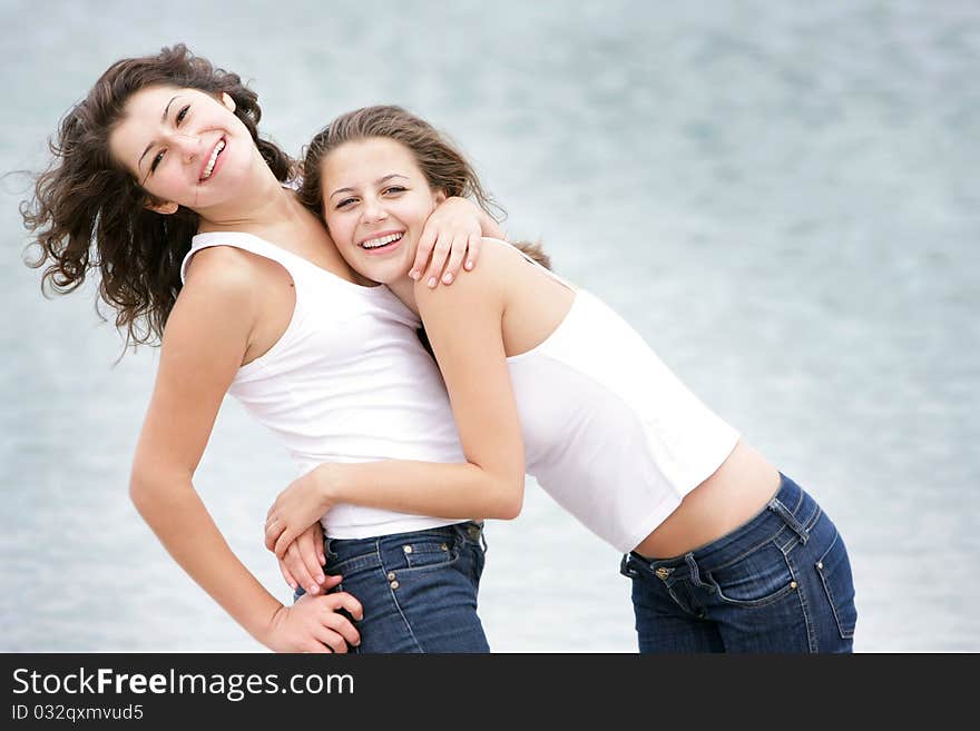 Young happy women on sea background