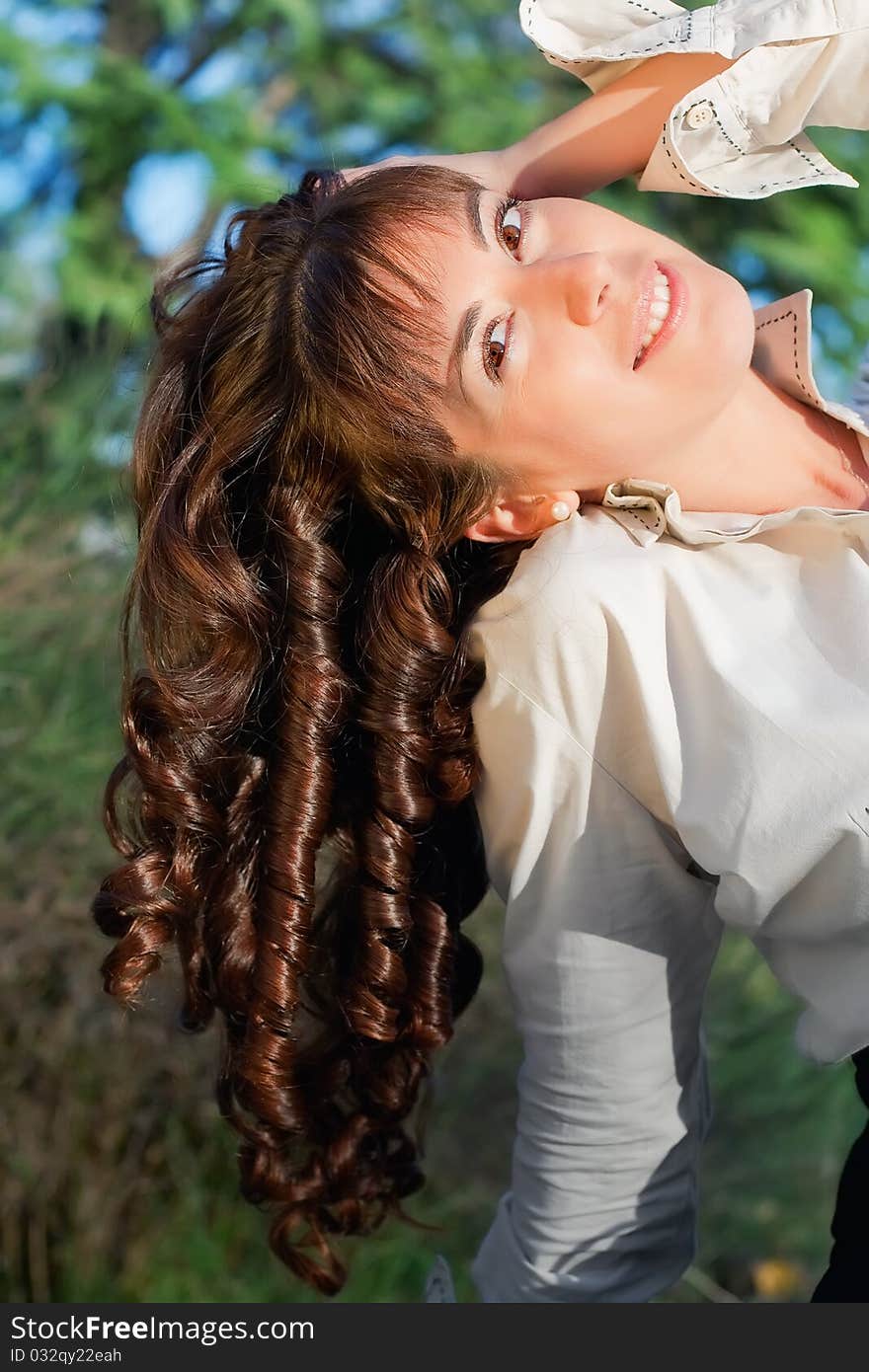 Portrait of beautiful young woman with curls