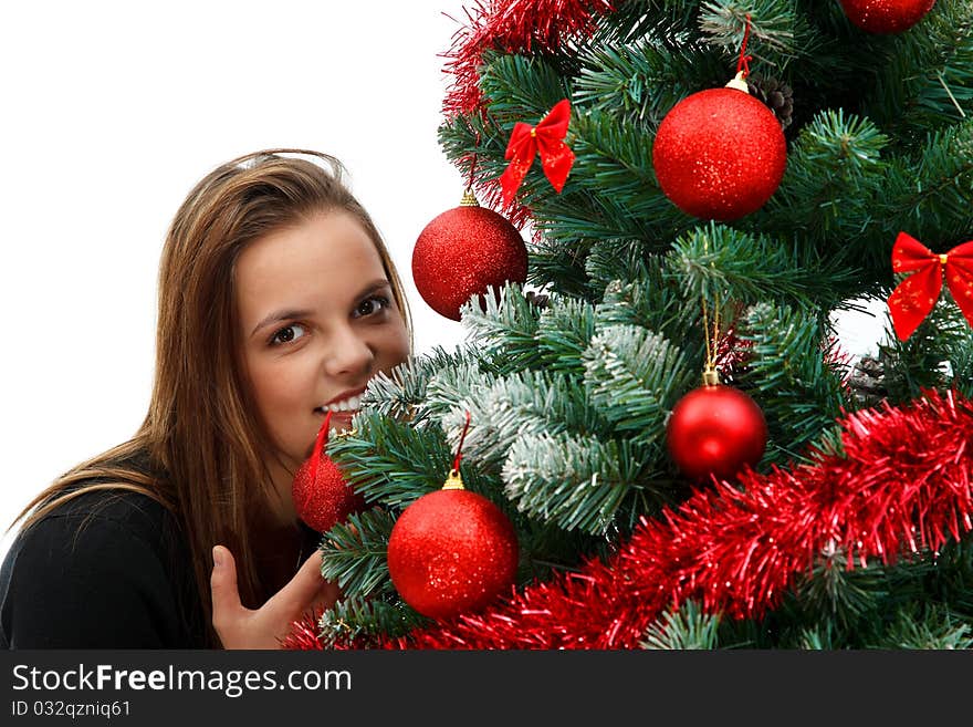 Beautiful young woman near the Christmas tree. Beautiful young woman near the Christmas tree