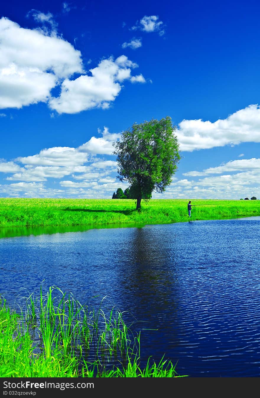 Blue lake and blue sky and summer field. Blue lake and blue sky and summer field