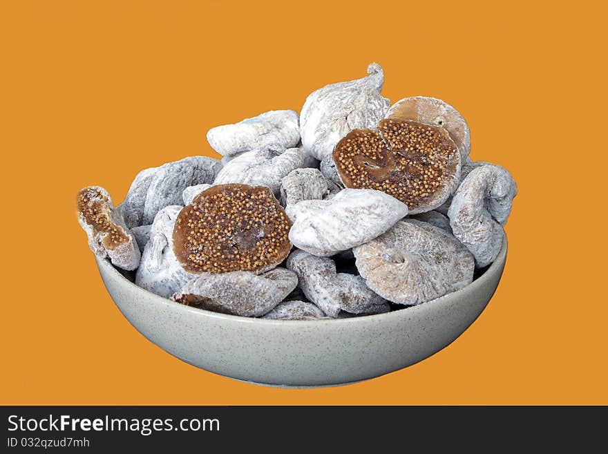 Dried figs in ceramic cup in isolated