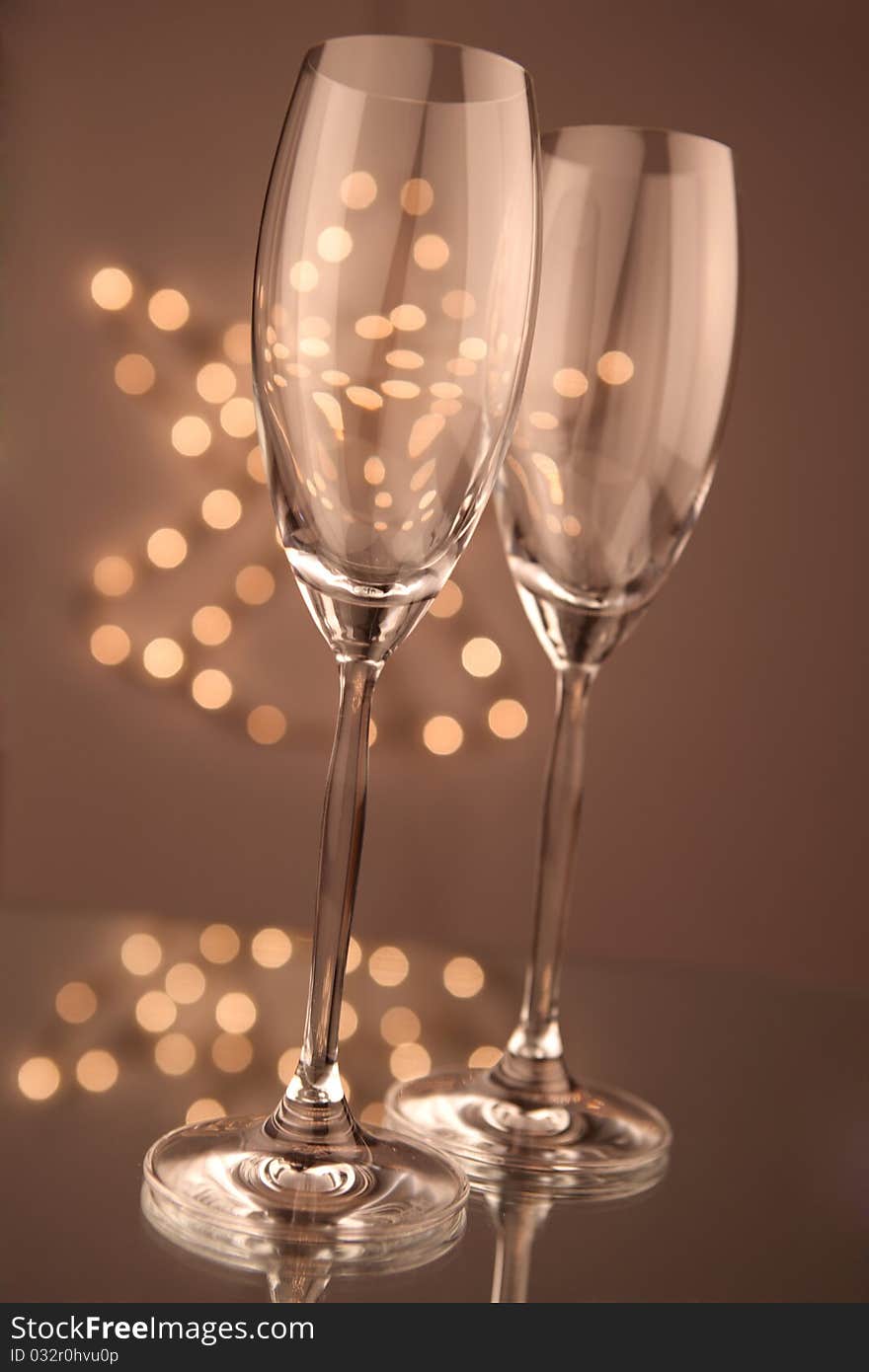 Glass of champagne on holiday background. Glass of champagne on holiday background