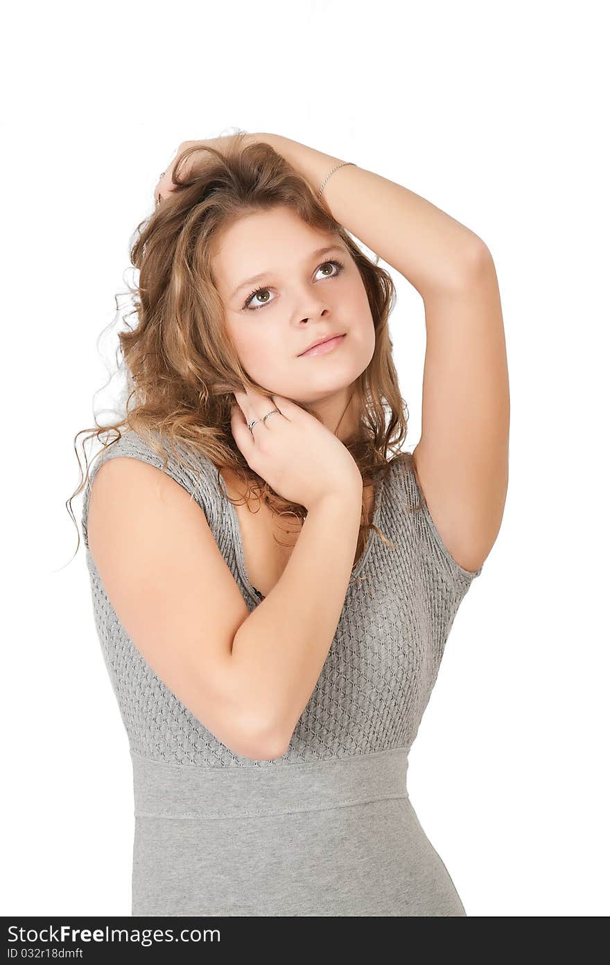 Young woman in a dress on a white background