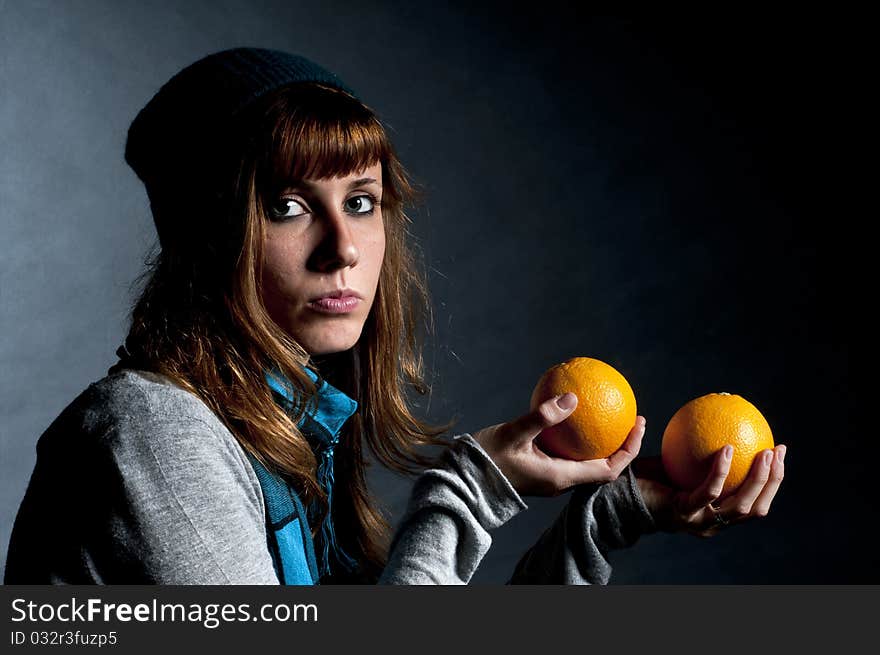 Girl with orange and hat with black background