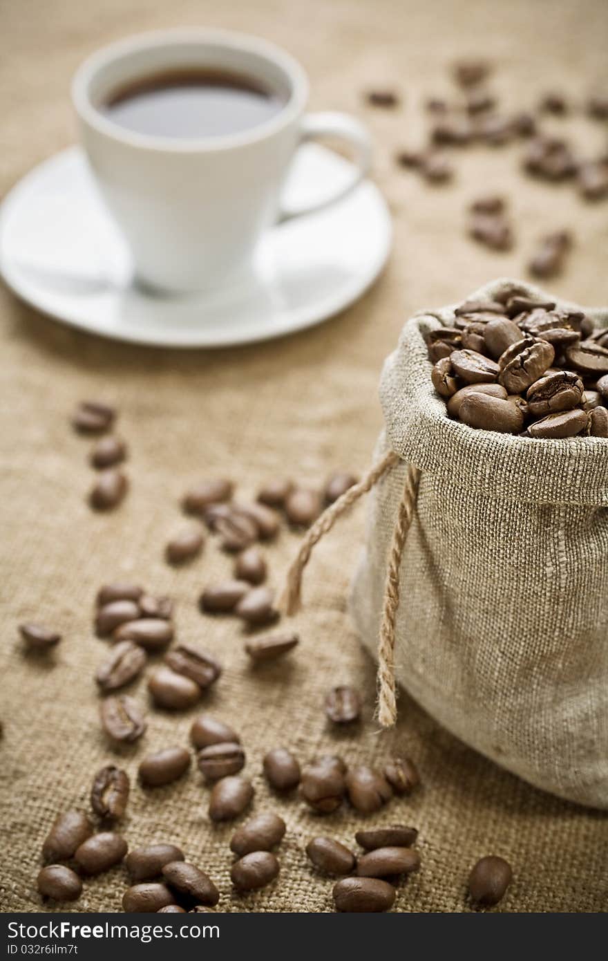 Coffee Beans And Cup Of Coffee