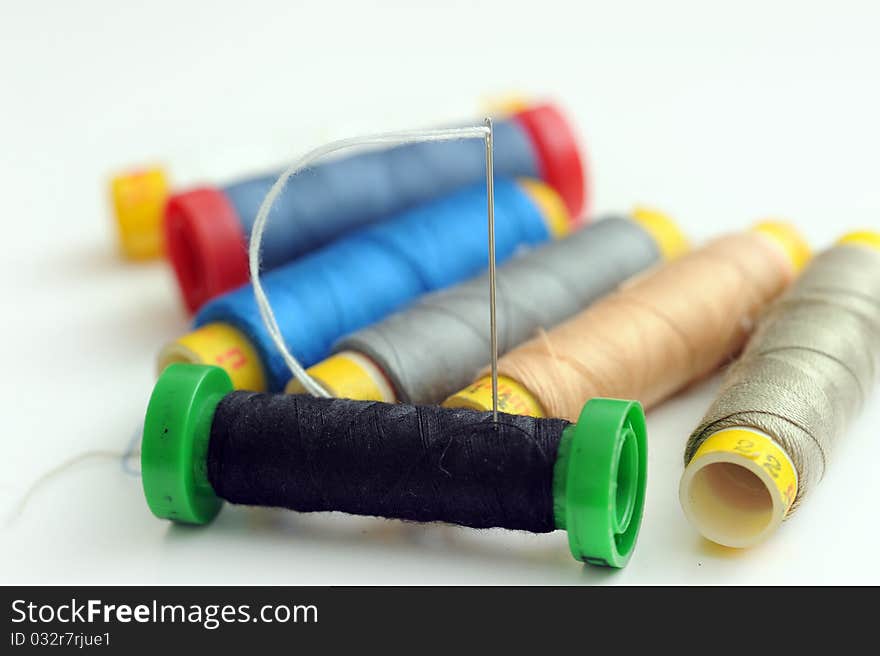 Various colour of reel of thread.