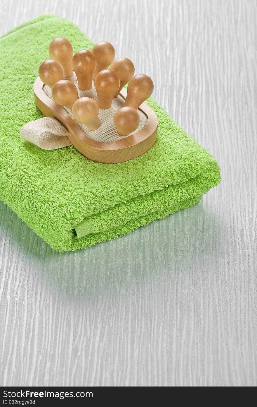 Massager on green towel