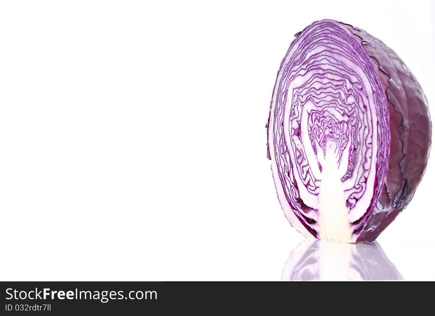 Close up of an organic purple cabbage, isolated on white background.