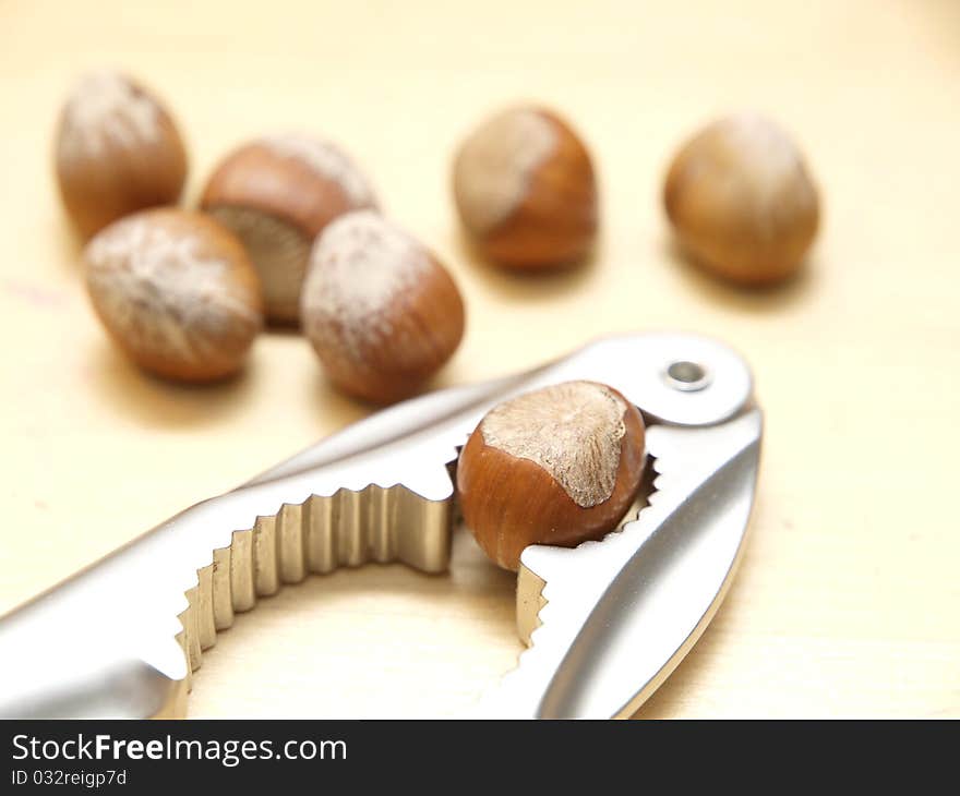 Hazelnuts on a table and a nutcracker