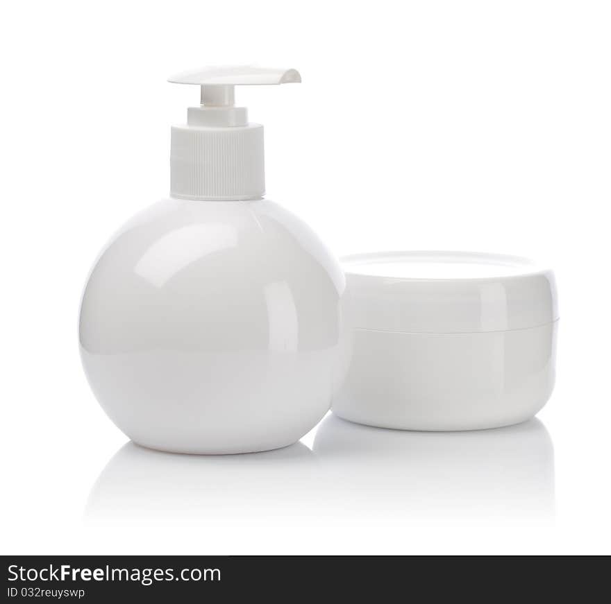 White plastical bottle with spray and jar with cream. White plastical bottle with spray and jar with cream