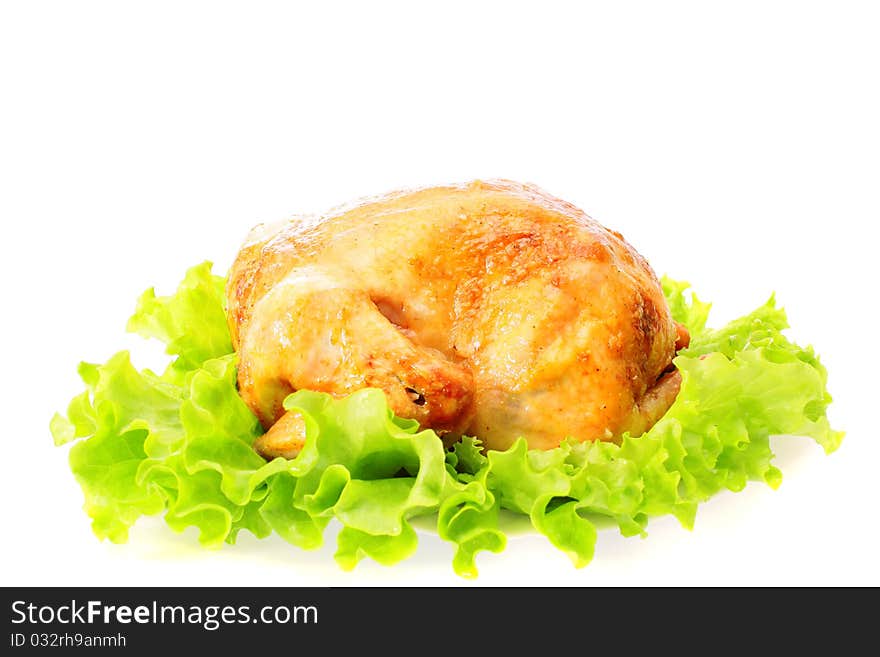 Roast chicken on leaves salad on a white background is isolated. Roast chicken on leaves salad on a white background is isolated.