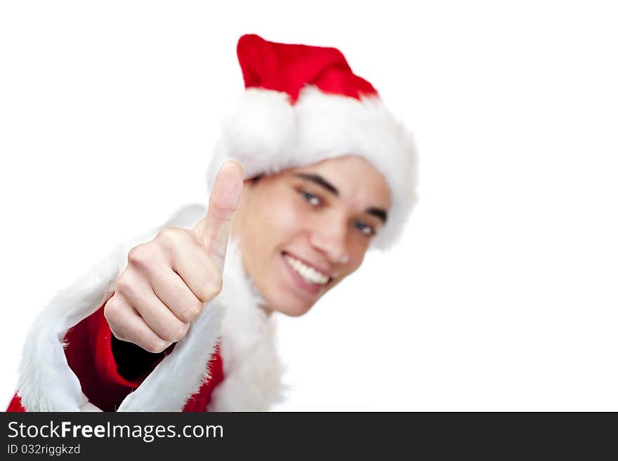 Smiling male santa claus teenager shows thumb up. Isolated on white background.