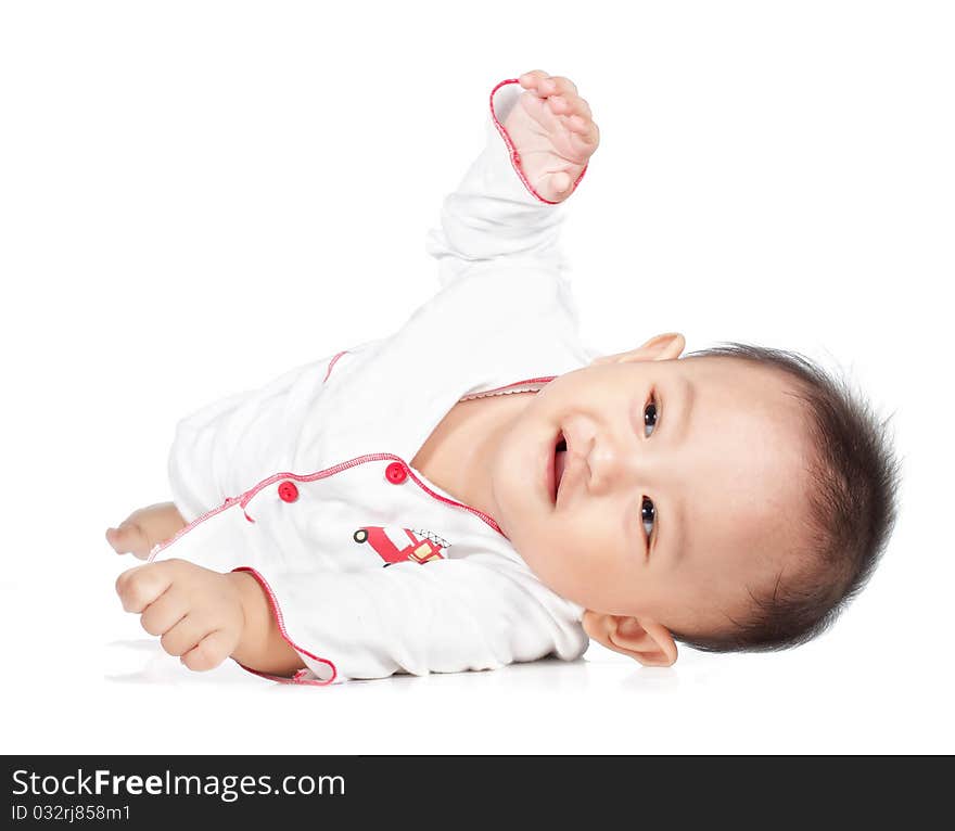 Portrait of litle baby lying and playing on the floor. Portrait of litle baby lying and playing on the floor