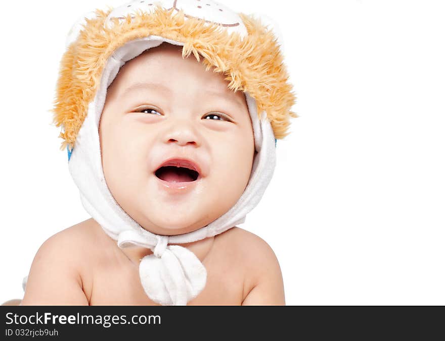 Closeup portrait of funny baby laughing with hat on his head. Closeup portrait of funny baby laughing with hat on his head