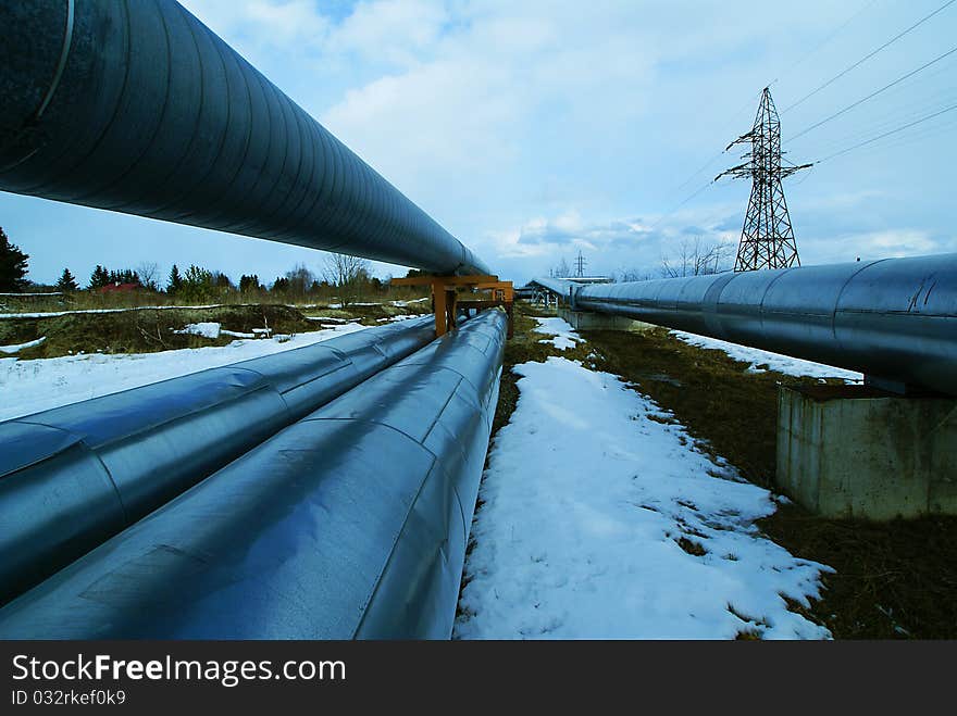 Industrial zone, Steel pipelines and smokestack against blue sky. Industrial zone, Steel pipelines and smokestack against blue sky