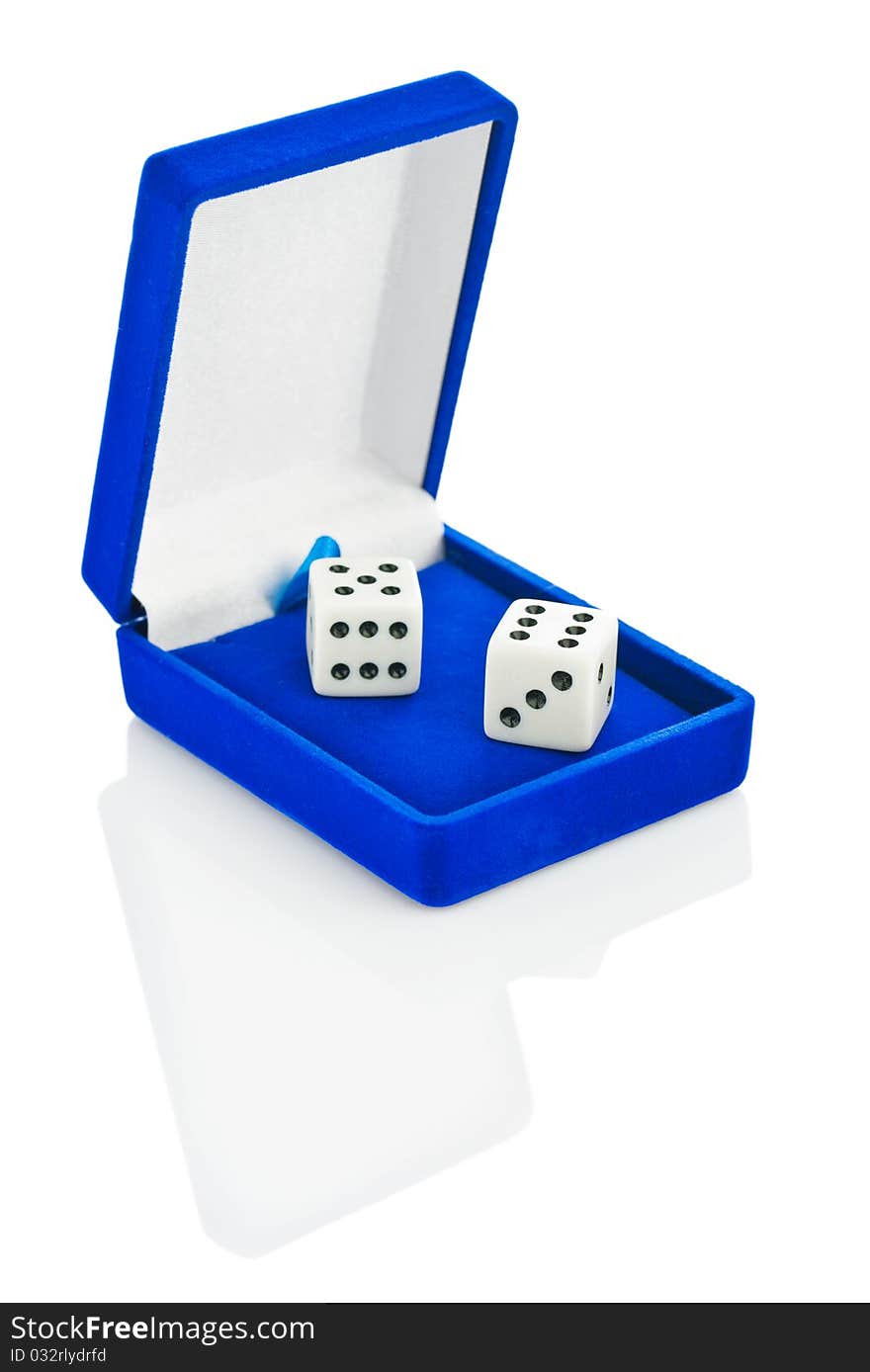 Studio shot. Two white plastic playing dice in blue box isolated. Studio shot. Two white plastic playing dice in blue box isolated