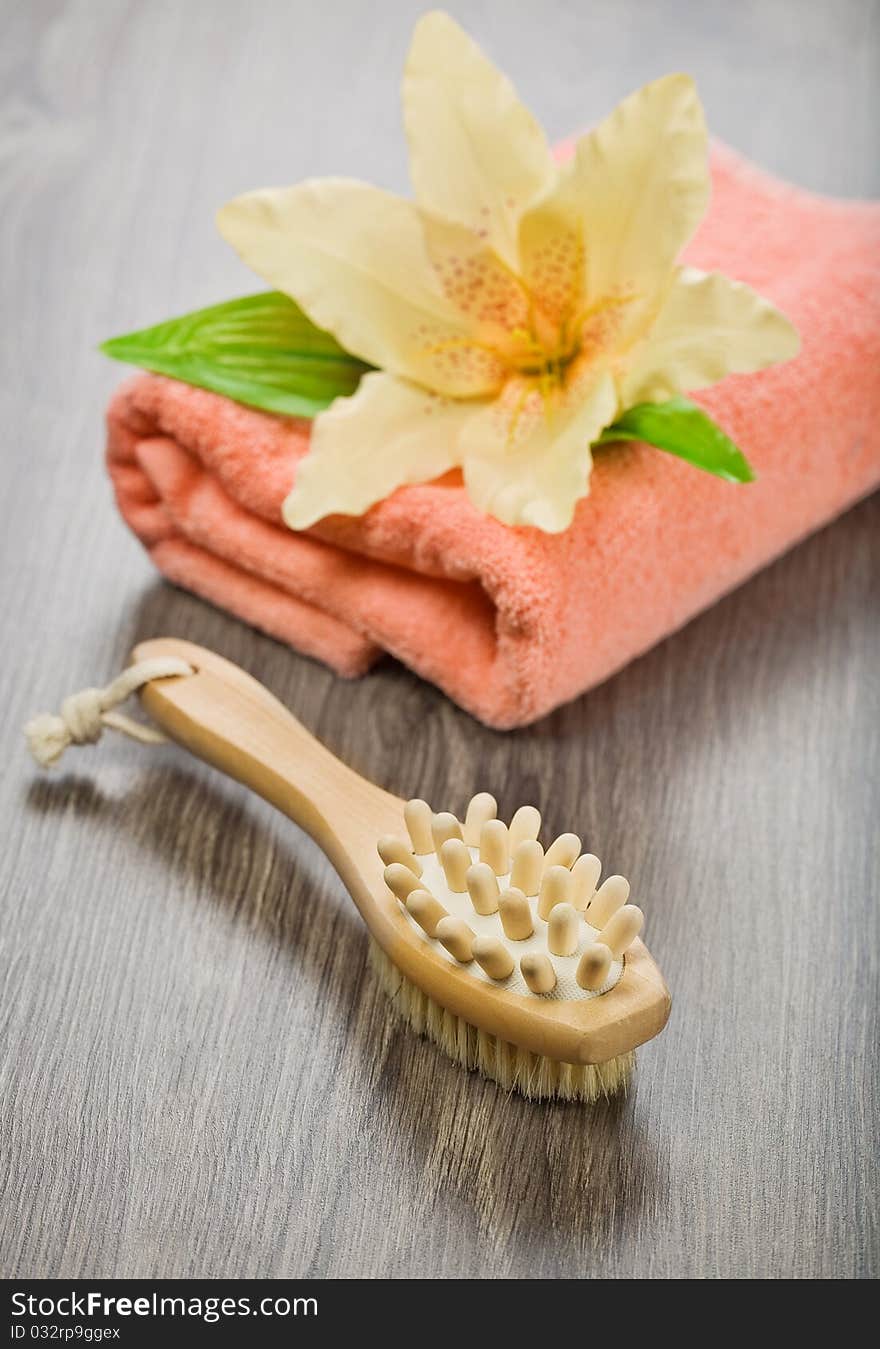 Flower On Pink Towel With Massager And Brush