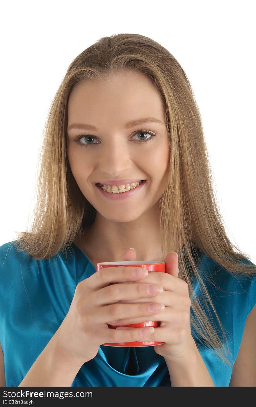 Woman with brackets on teeth and cup isolated in white