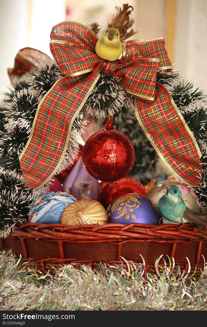 Two beautiful birds sitting on the Christmas basket. Two beautiful birds sitting on the Christmas basket