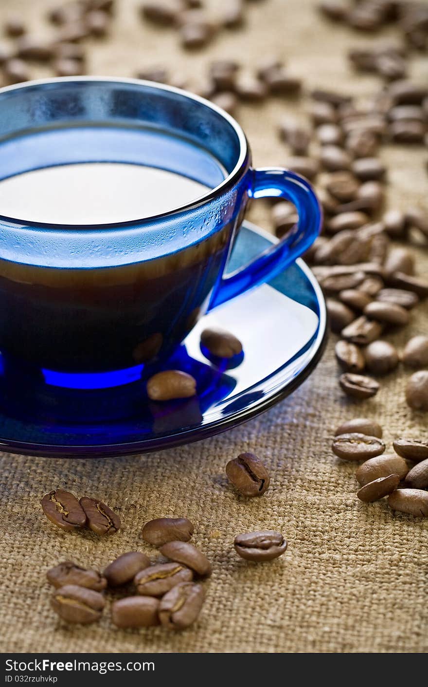 Coffee Beans With Cup On Saucer