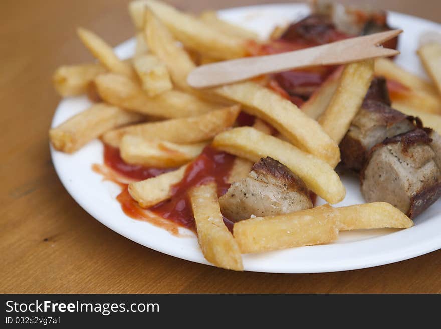 German curry wurst with french fries. German curry wurst with french fries