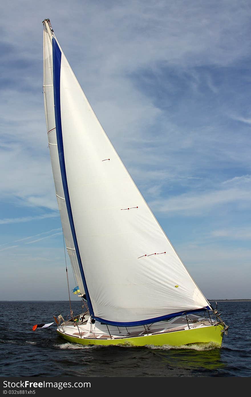 The sailing yacht in speed. Strong wind and clear sky