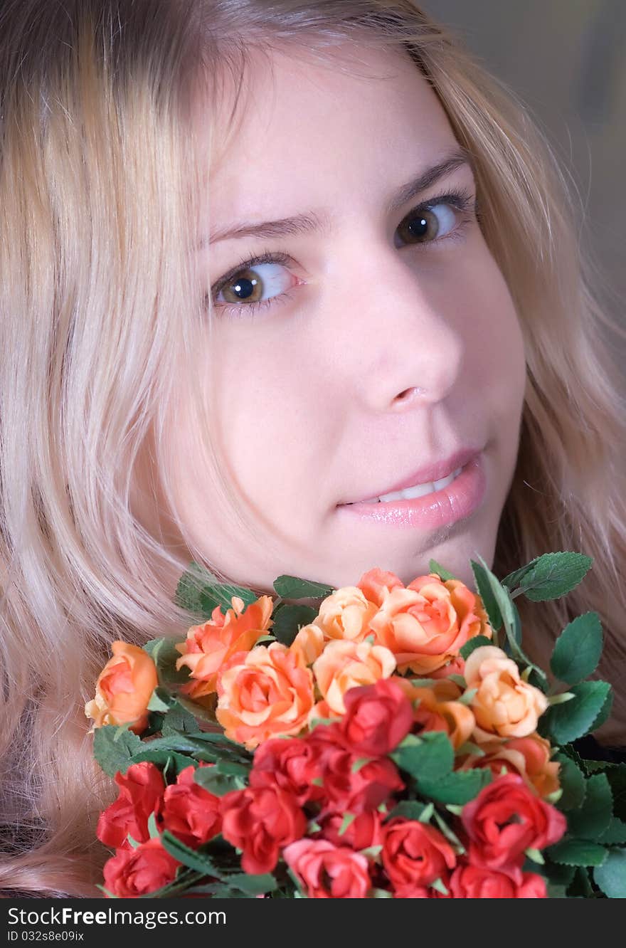 Portrait of beautiful teen smiling and holding bouquet of roses. Portrait of beautiful teen smiling and holding bouquet of roses.