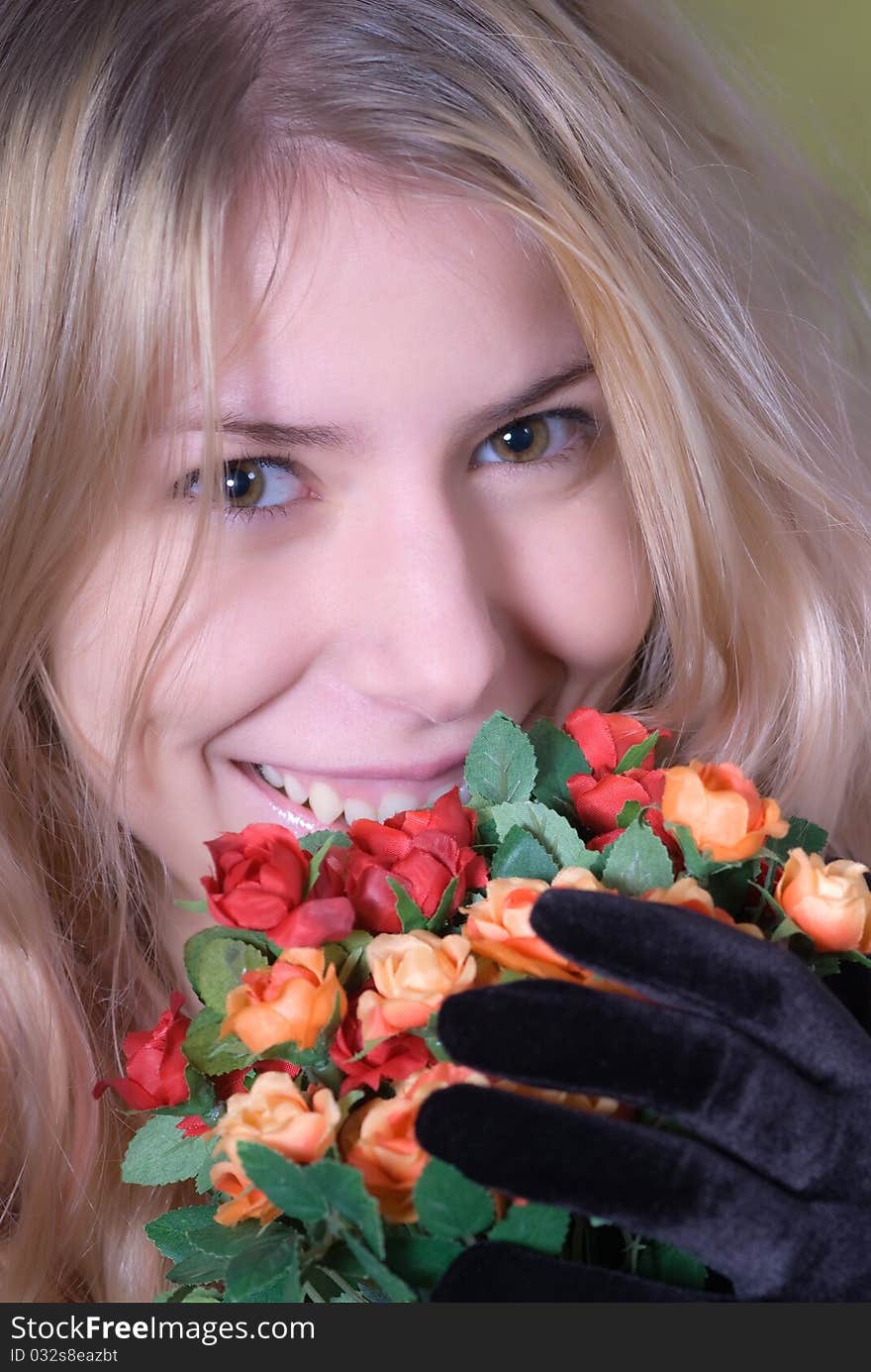 Portrait of beautiful teen smiling and holding bouquet of roses. Portrait of beautiful teen smiling and holding bouquet of roses.