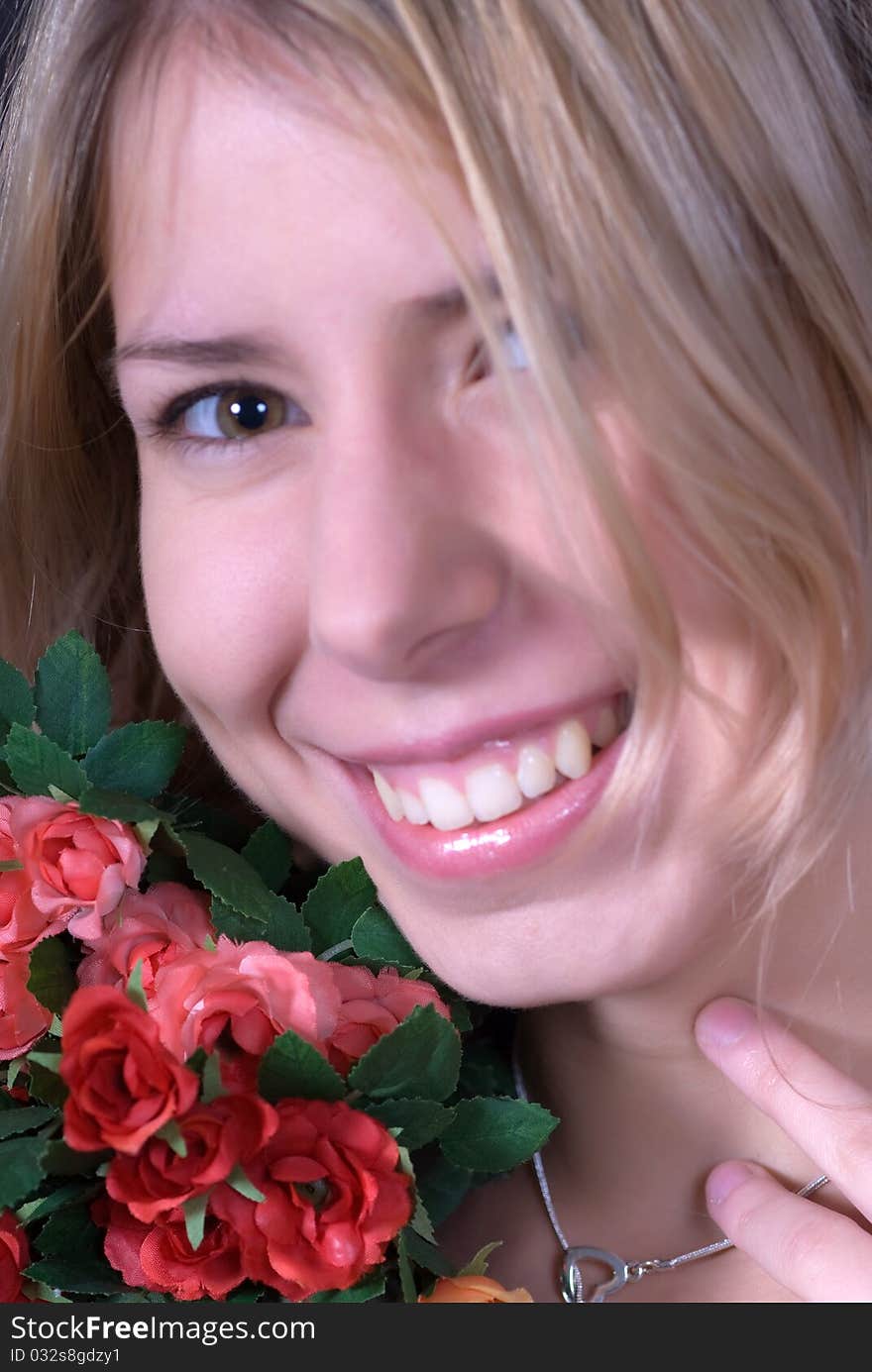 Portrait of beautiful teen smiling and holding bouquet of roses. Portrait of beautiful teen smiling and holding bouquet of roses.