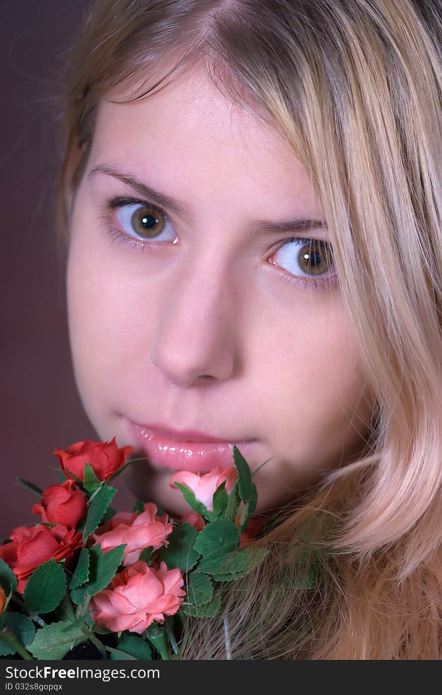 Portrait of beautiful teen smiling and holding bouquet of roses. Portrait of beautiful teen smiling and holding bouquet of roses.