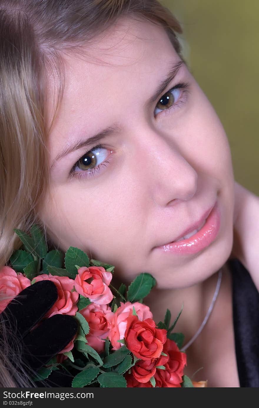 Portrait of beautiful teen smiling and holding bouquet of roses. Portrait of beautiful teen smiling and holding bouquet of roses.