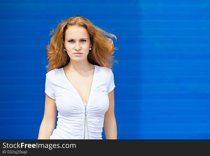 Businesswoman posing over old factory