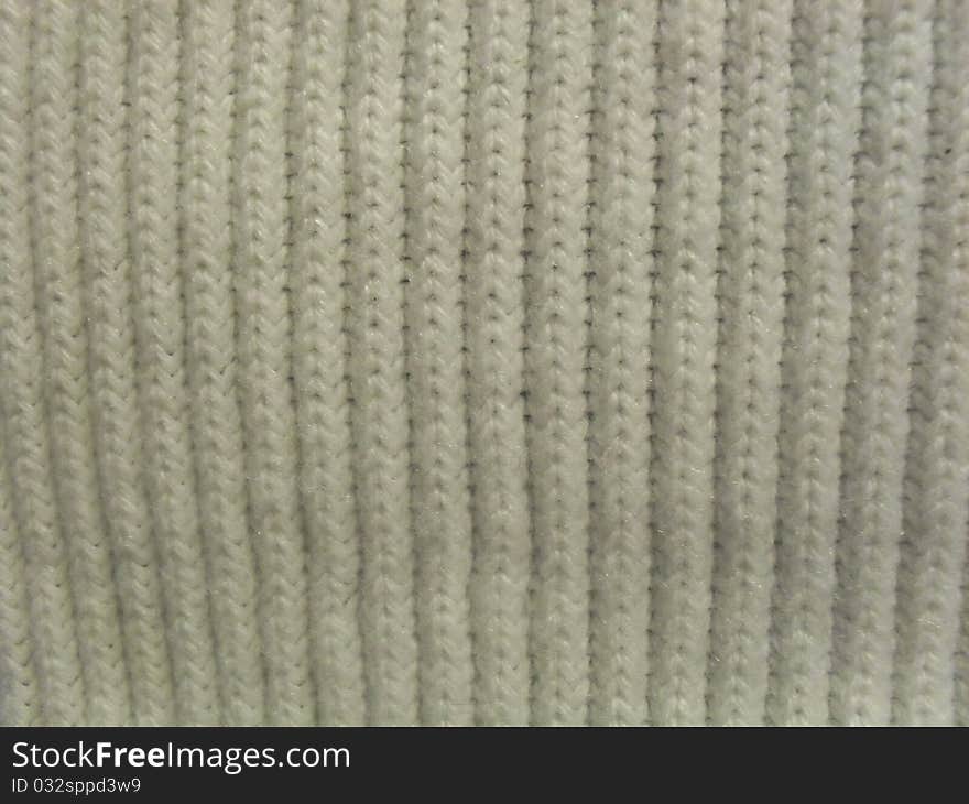 White knit pattern material background texture closeup. White knit pattern material background texture closeup