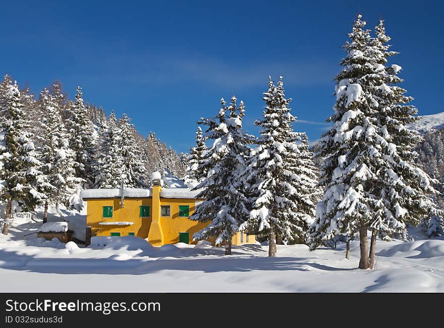 Trivigno mountain dew at 2000 meters on the sea-level. During winter the lake in front to the dew is icy and under snow. Brixia province, Lombardy region, Italy. Trivigno mountain dew at 2000 meters on the sea-level. During winter the lake in front to the dew is icy and under snow. Brixia province, Lombardy region, Italy