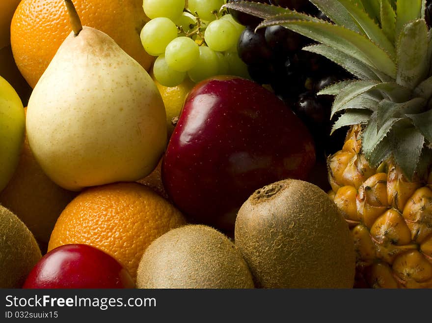 Fresh organic mixed fruit in a cardboard box. Fresh organic mixed fruit in a cardboard box