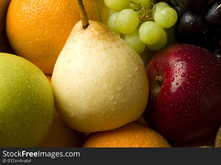 Fresh organic mixed fruit in a cardboard box. Fresh organic mixed fruit in a cardboard box