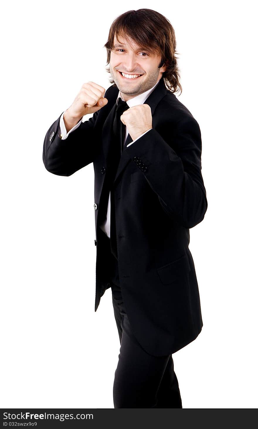 Young funny businessman in boxing pose, white background