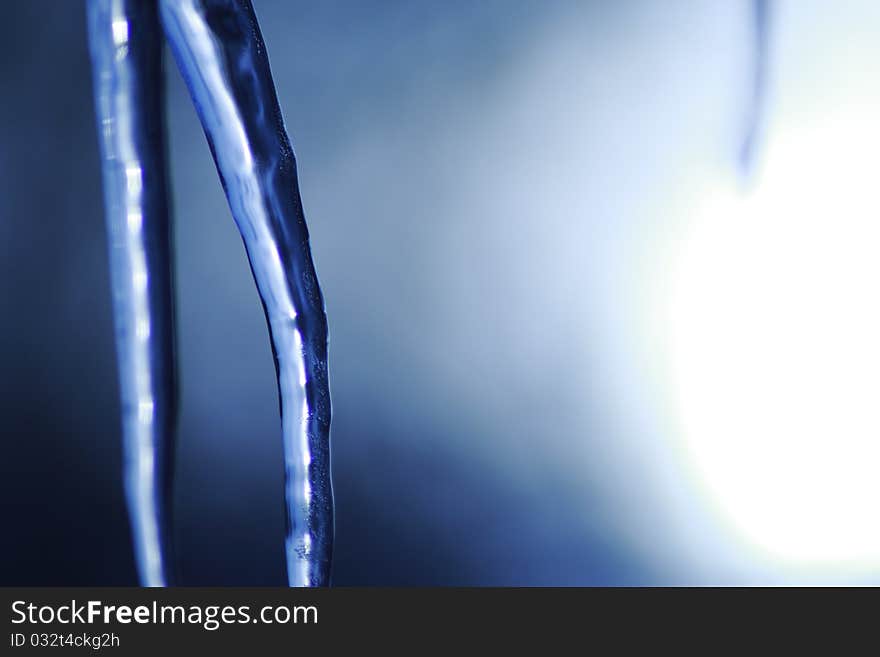 Icicle coming down from our roof. The blurred background is the sky. December 2010. Icicle coming down from our roof. The blurred background is the sky. December 2010