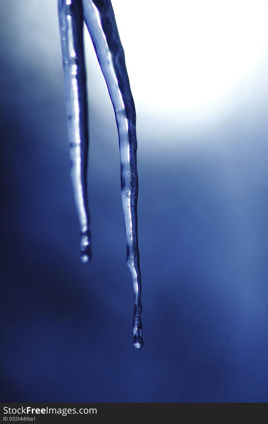 Icicle coming down from our roof. The blurred background is the sky. December 2010. Icicle coming down from our roof. The blurred background is the sky. December 2010