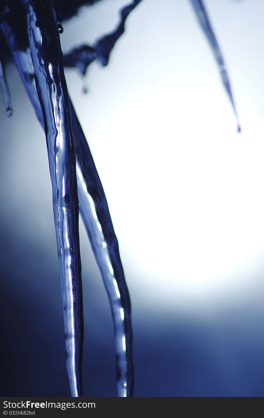 Icicle coming down from our roof. The blurred background is the sky. December 2010. Icicle coming down from our roof. The blurred background is the sky. December 2010