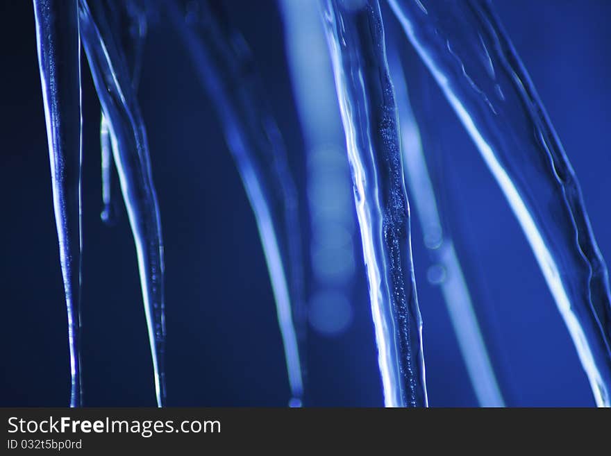 Icicle coming down from our roof. The blurred background is the sky. December 2010. Icicle coming down from our roof. The blurred background is the sky. December 2010