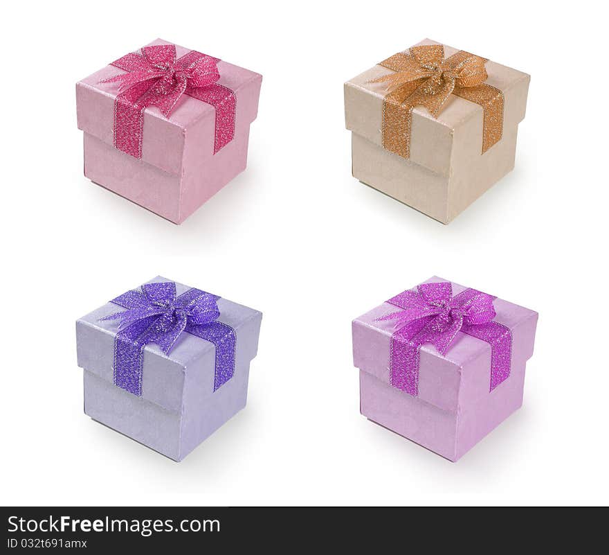 Image of four different color of gift box with ribbon