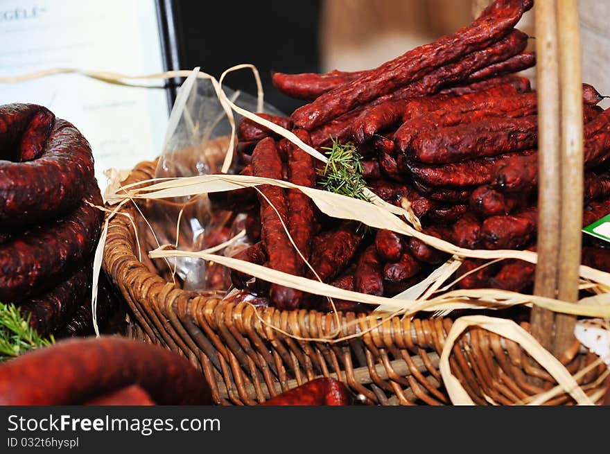 Selection of cold meat (ham smoked, sirloin, headcheese, sausages, hot dogs) at outdoor market