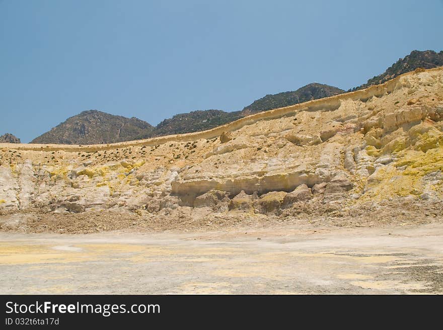 View from volcano on island of Nisyros showing coloured minerals in rock. View from volcano on island of Nisyros showing coloured minerals in rock.