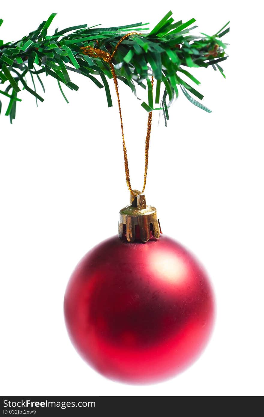 Decoration on a branch of manufactured christmas tree isolated on the white background. Decoration on a branch of manufactured christmas tree isolated on the white background