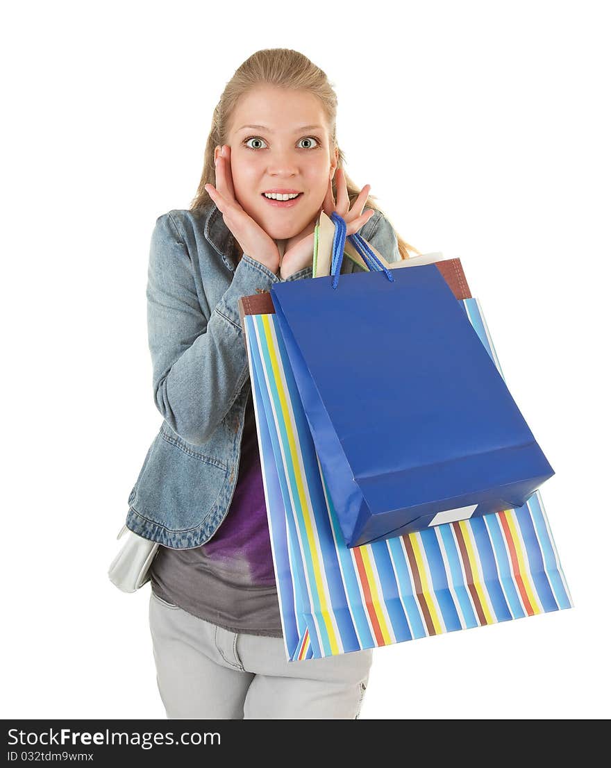 Young girl with purchases on white background