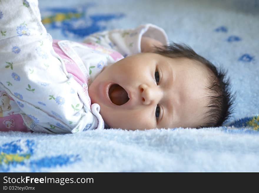 The falling asleep child on a soft blanket. The falling asleep child on a soft blanket