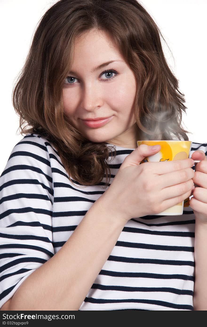 A close-up portrait of a beautiful woman holding a yellow cup of tea or coffee isolated on white background. A close-up portrait of a beautiful woman holding a yellow cup of tea or coffee isolated on white background