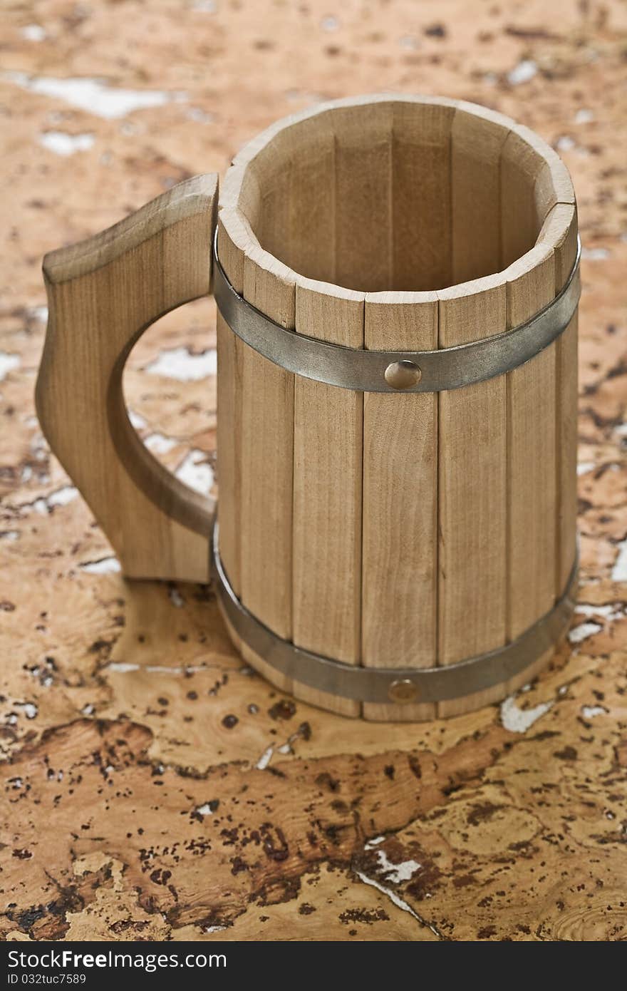 Close up the wooden bathing mug on a background of the cork tree. Close up the wooden bathing mug on a background of the cork tree