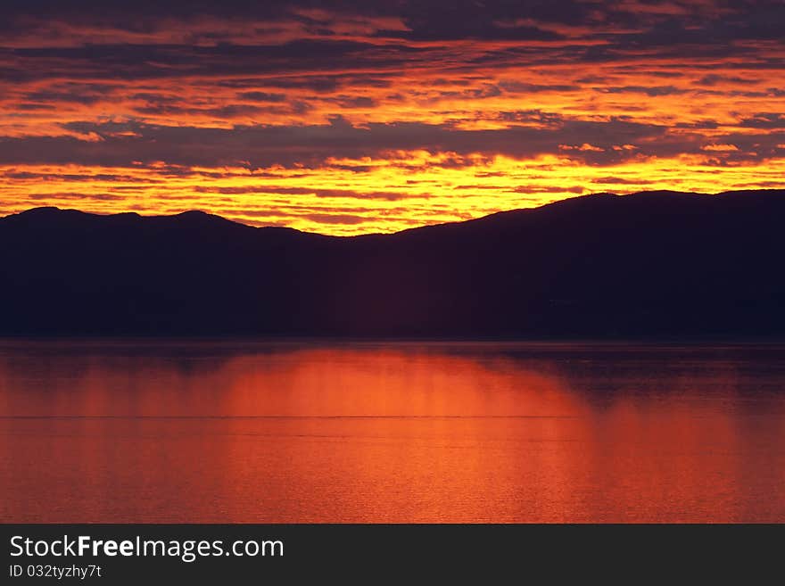 Red sunset over sea calm for wallpaper use